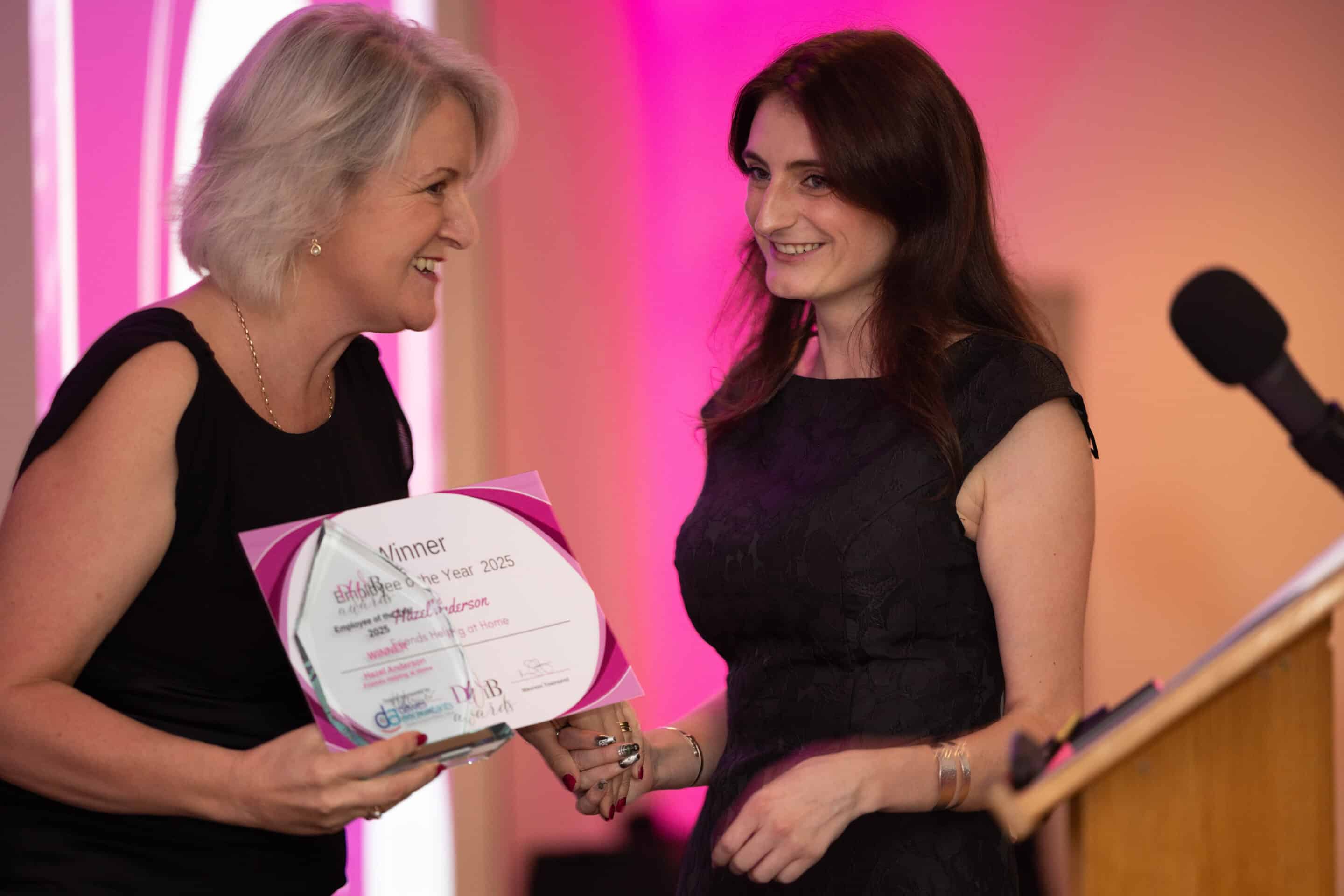 Louise Jenner, The Dream Job Coach, presents Hazel Anderson with her certificate and trophy for winning the DWIB Award, Employee of the Year 2025.
