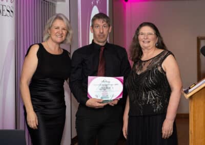 Louise Jenner and Maureen Townsend present Derek Weeks with his DWIB Award for winning the Best Supporting Act category 2025.