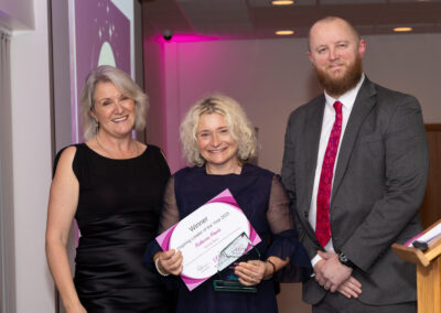 Louise Jenner and Gavni Harris present the DWIB Award 2025 for Inspirational Leader to Katherine Hawke (centre).