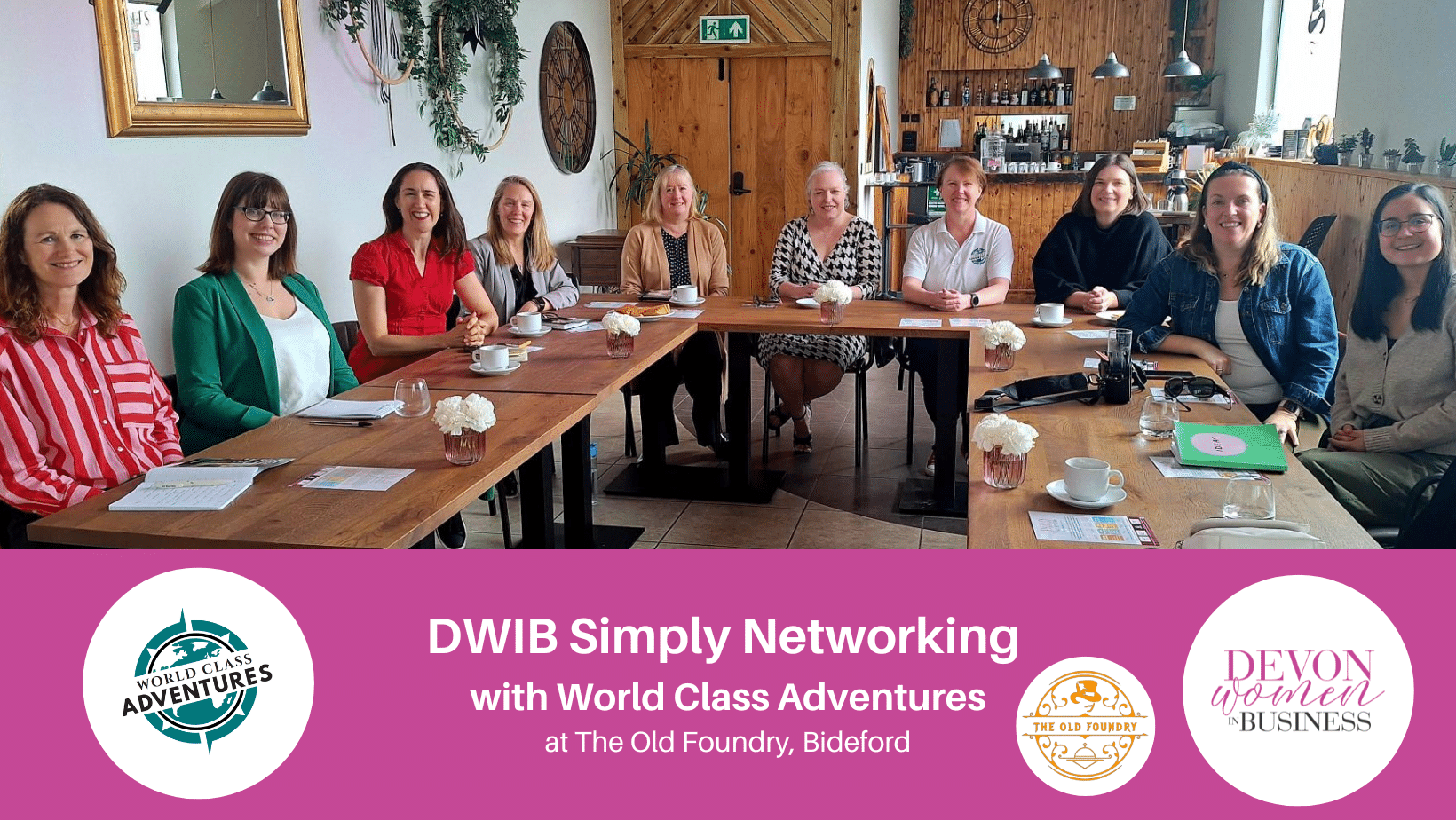 Photo of a group of women seated around wooden tables in a bright café space at The Old Foundry in Bideford, smiling at the camera during a Devon Women in Business networking event. A pink banner below reads “DWIB Simply Networking with World Class Adventures at The Old Foundry, Bideford,” alongside the World Class Adventures, The Old Foundry, and Devon Women in Business logos. 💖